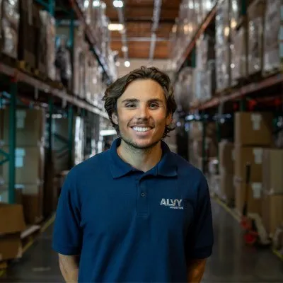 Noah Alvarez, founder and CEO of Alvy Logistics, in a warehouse aisle